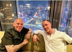 Stuart Bingham and a friend above a city at night